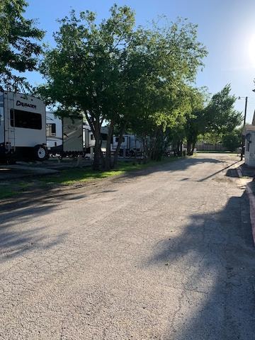 Settlers Haven RV Park - tree-lined park road with RVs